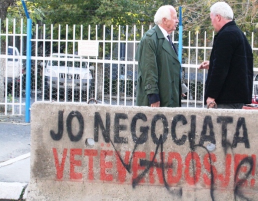 Two man and graffiti, by Vedat Xhymshiti